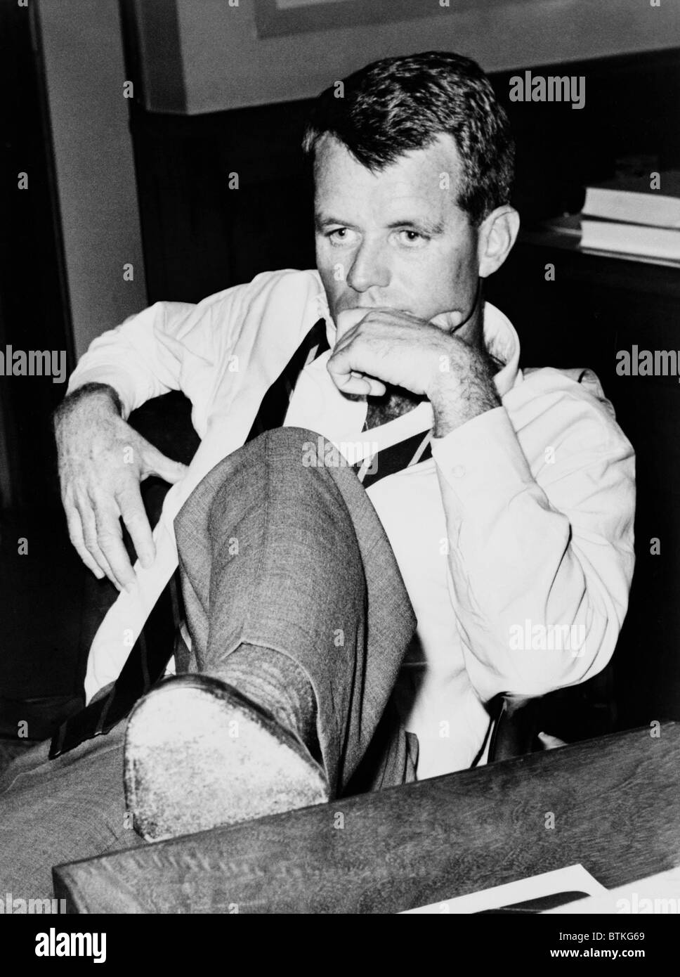 Attorney General Robert F. Kennedy, seated at desk, in 1961 Stock Photo