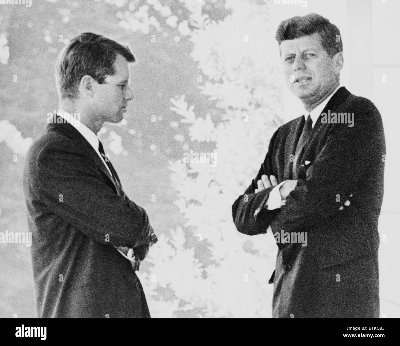 Brothers Robert F. and John F. Kennedy, portrait, standing on the White House portico. Ca. 1962. Stock Photo