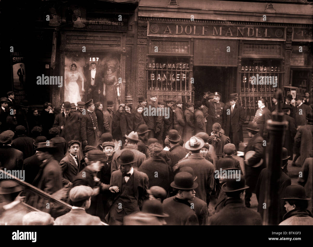Police keep order during a run on the Adolf Mandel Bank on New York City's Lower East Side. February 16, 1912. Stock Photo