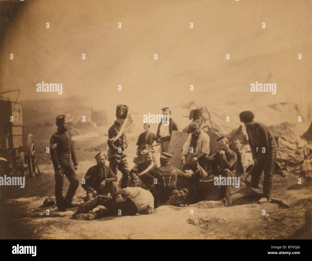 COOKING HOUSE, 8TH HUSSARS, 1855, by Roger Fenton. Soldiers are