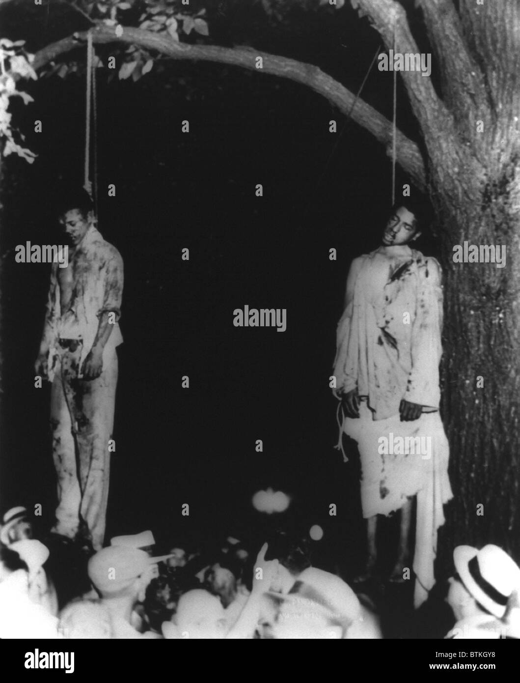 Two lynched African American men, hanging from tree in Marion, Indiana. Ca. 1930s. Stock Photo