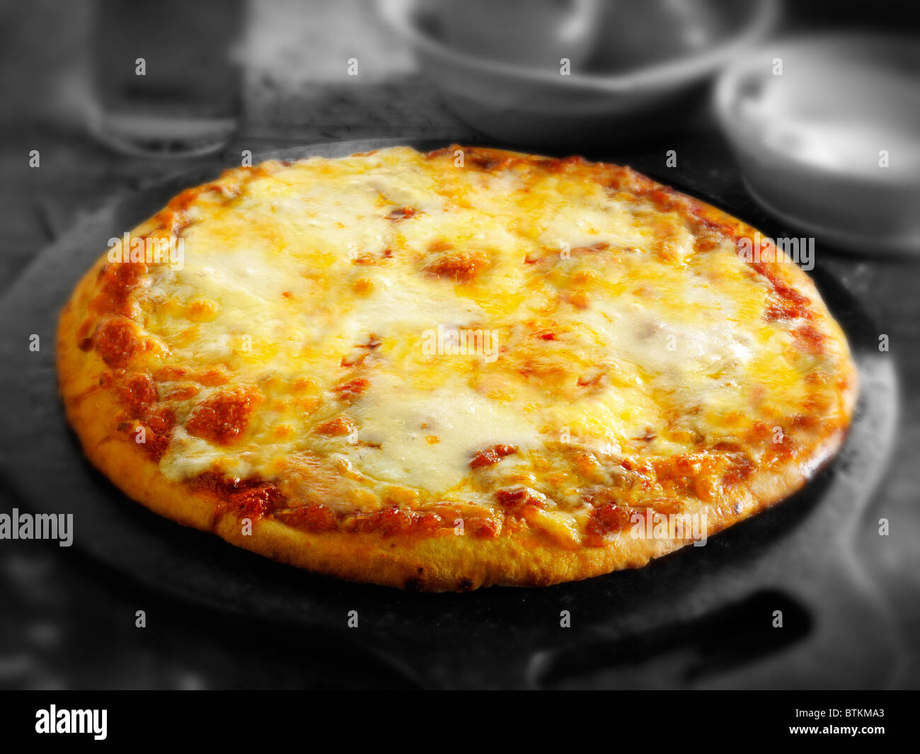 Whole Cheese and Tomato thin crust pizza Stock Photo