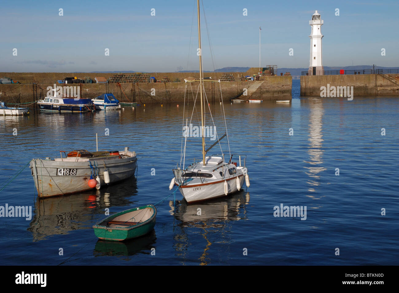 A quiet Sunday morning at Newhaven Harbour on the Firth of Firth in Edinburgh Scotland, UK. Stock Photo