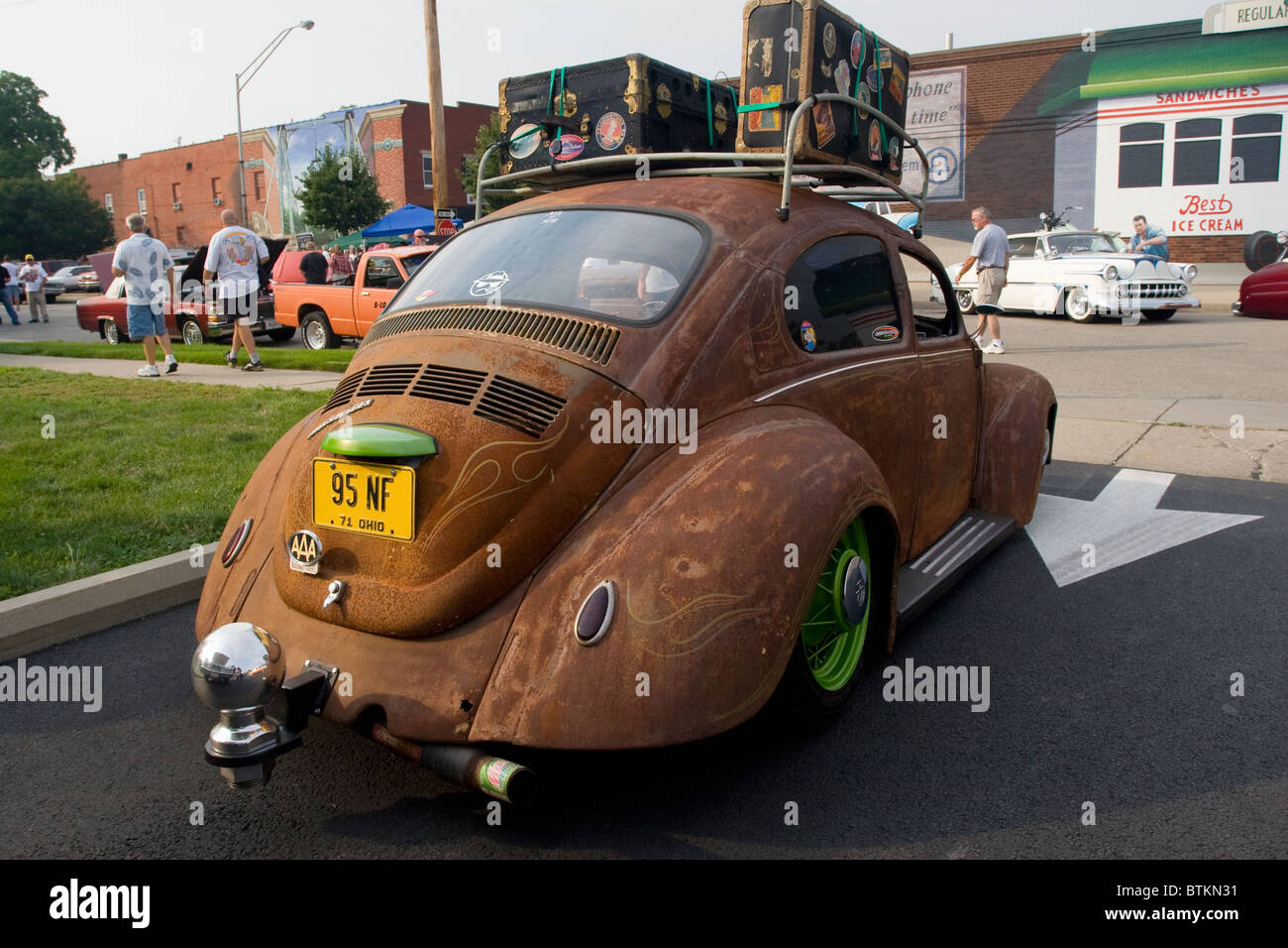 Auto- 1971 Volkswagon Beetle with modified shape, lots of rust, and extremely large trailer hitch. 95NF Stock Photo