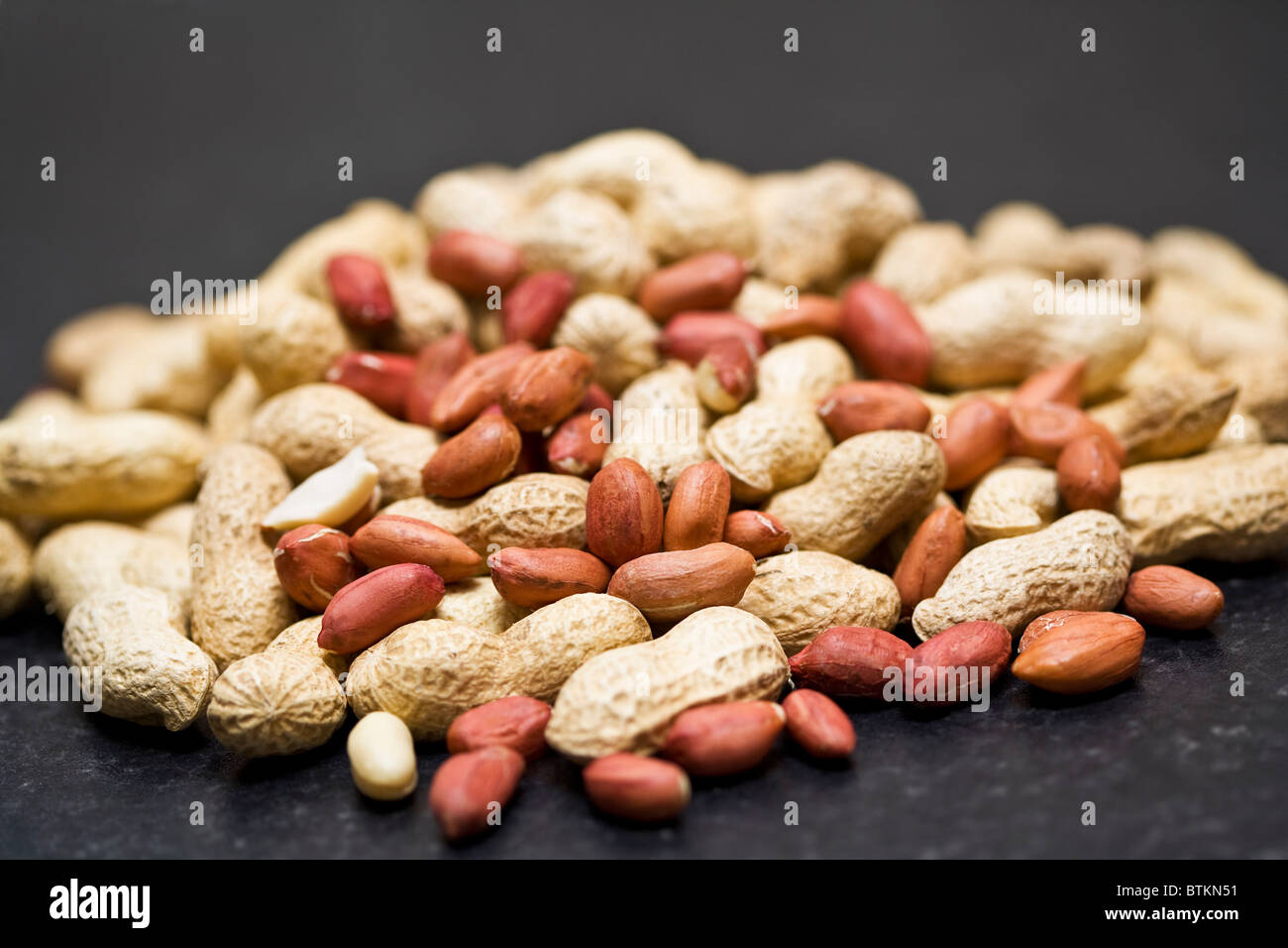 Peanuts on a dark background Stock Photo