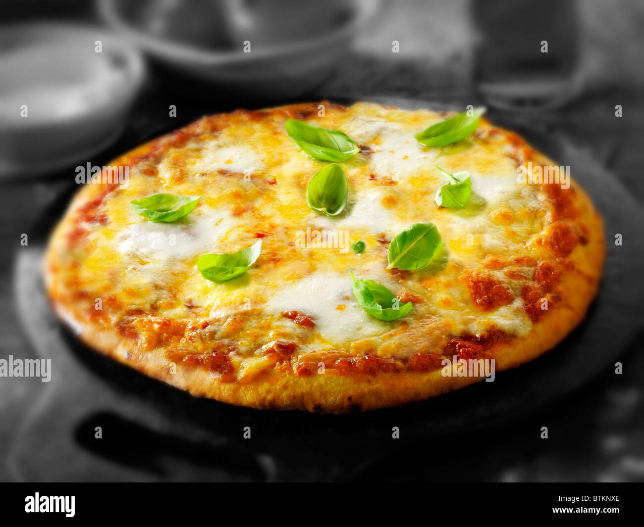 Whole Cheese and Tomato thin crust pizza Stock Photo