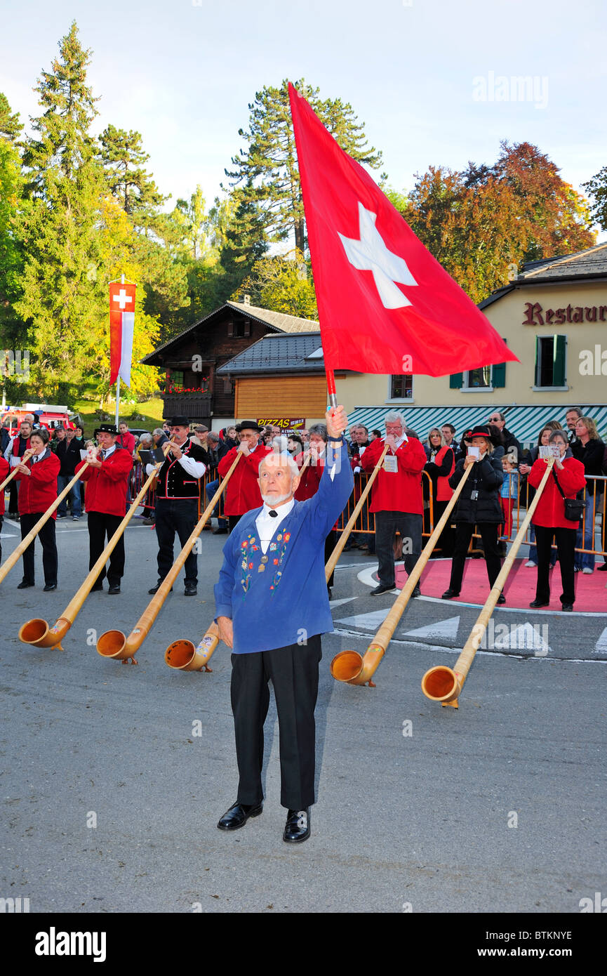 Flag throwing is a traditional activity in Switzerland, usually accompanied by alphorns playing Stock Photo