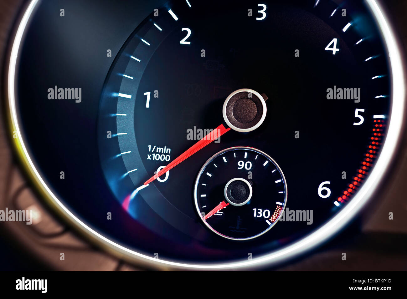 Modern car illuminated dashboard closeup, tachometer Stock Photo Alamy
