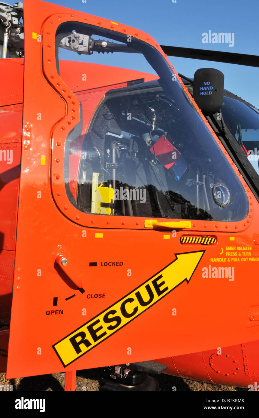 Rescue logo on side door of cockpit of United States Coast Guard Search and Rescue Jayhawk Helicopter. Stock Photo