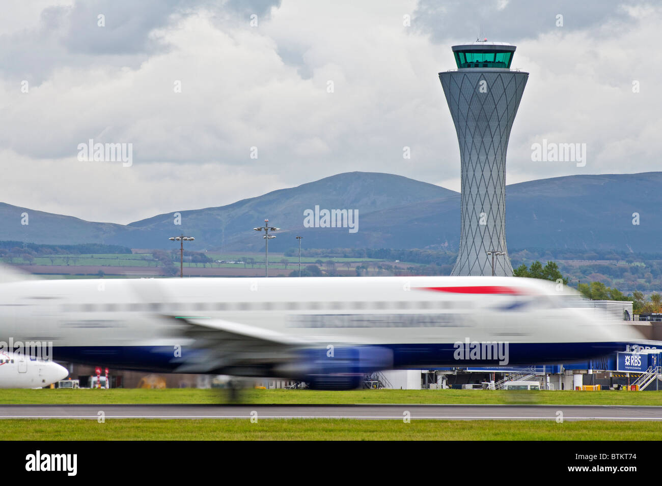 A British Airways (BA) plane blurred on the runway at Edinburgh aiport, Scotland, UK Stock Photo