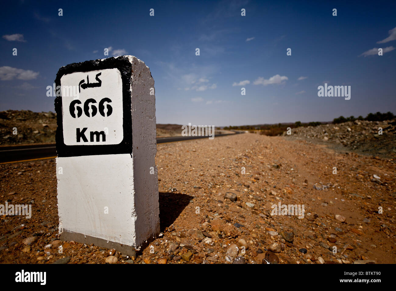 A 666km sign on the side of the road Stock Photo