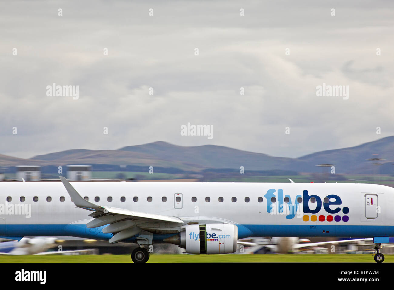 A Flybe plane landing at Edinburgh aiport, Scotland, UK Stock Photo