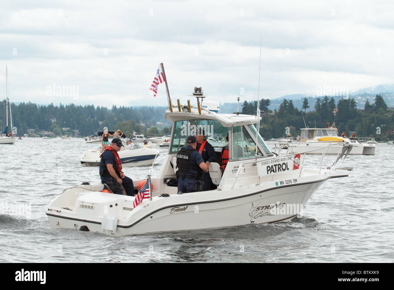 Coast Guard Auxiliary crew providing security at the Seafair Airshow on Lake Washington. Appears to have fully commissioned crew Stock Photo