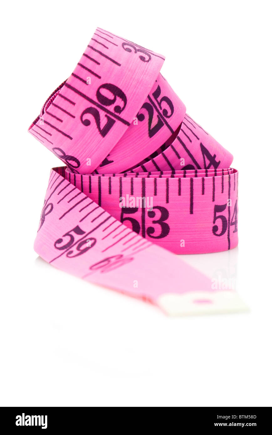 Inch scale pink measuring tape on white background Stock Photo