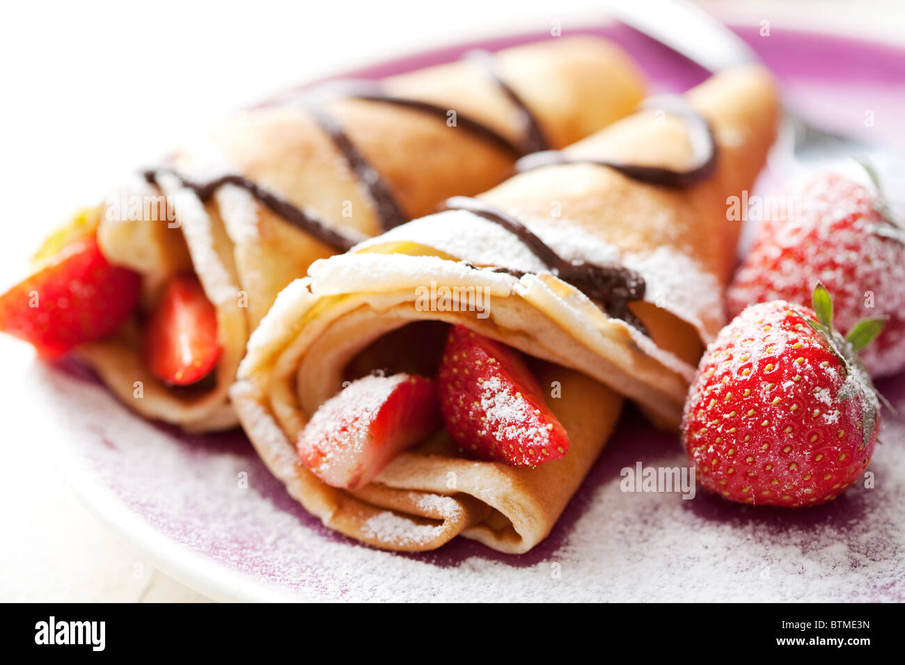 crepes and strawberries Stock Photo