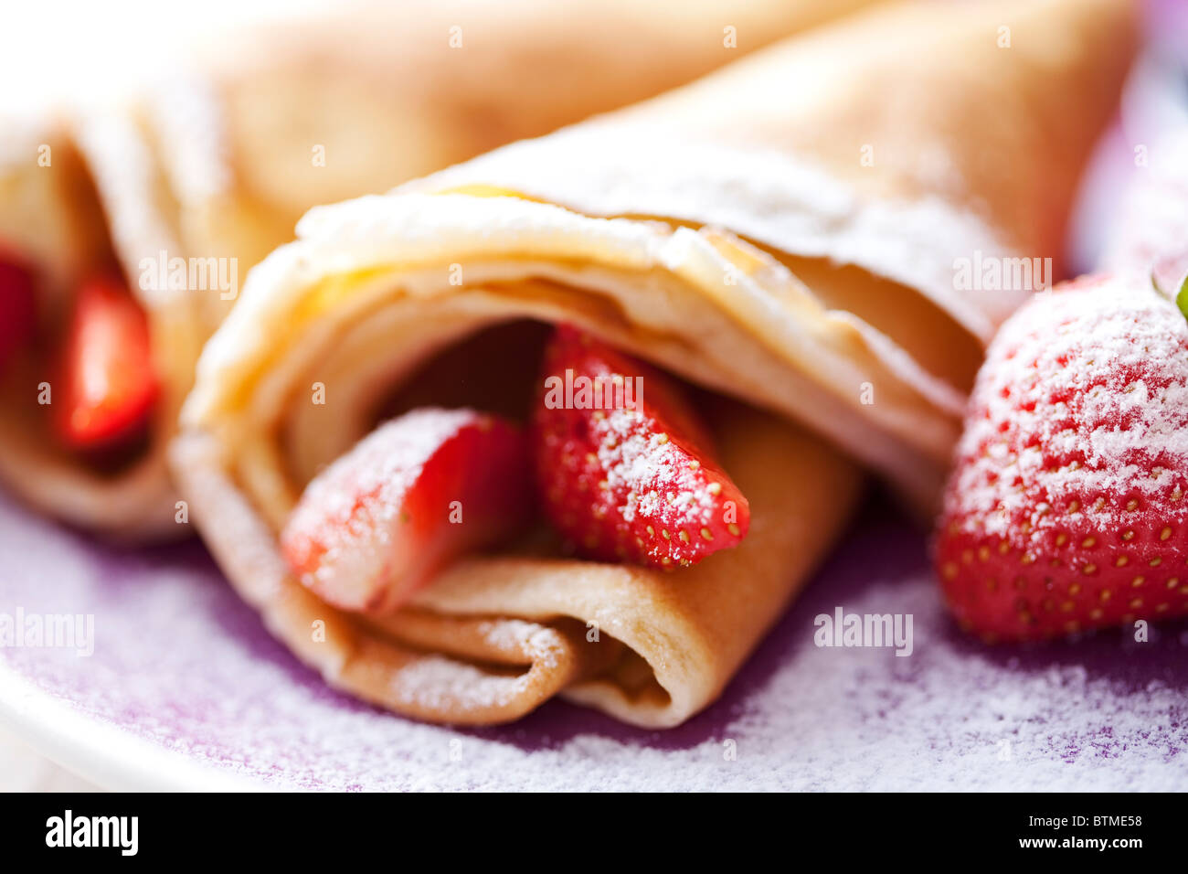 crepes and strawberries Stock Photo