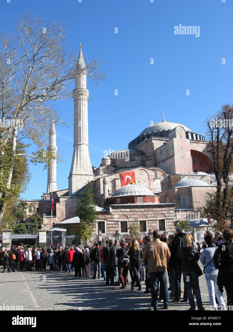 ISTANBUL, TURKEY. A long line of tourists queuing on Sultanahmet Square to get into Haghia Sophia museum. 2010. Stock Photo