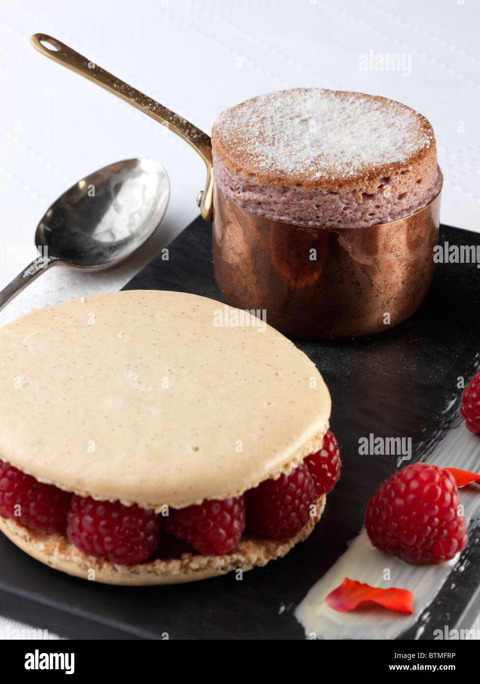 Individual chocolate souffle and raspberry shortcake Stock Photo