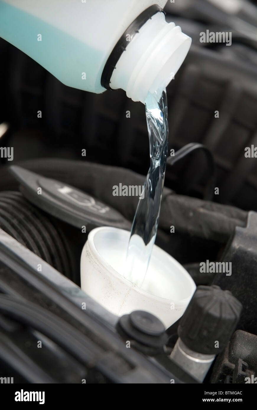 Filling Windscreen Washer Bottle with Screenwash Stock Photo Alamy