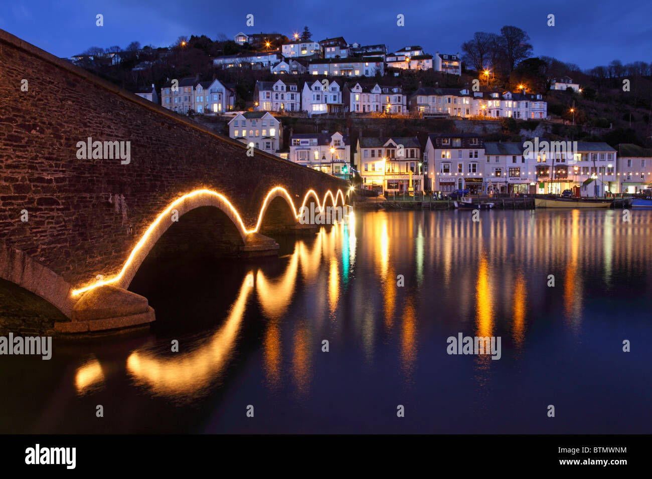 The road bridge across Looe River in south east Cornwall captured during twilight Stock Photo