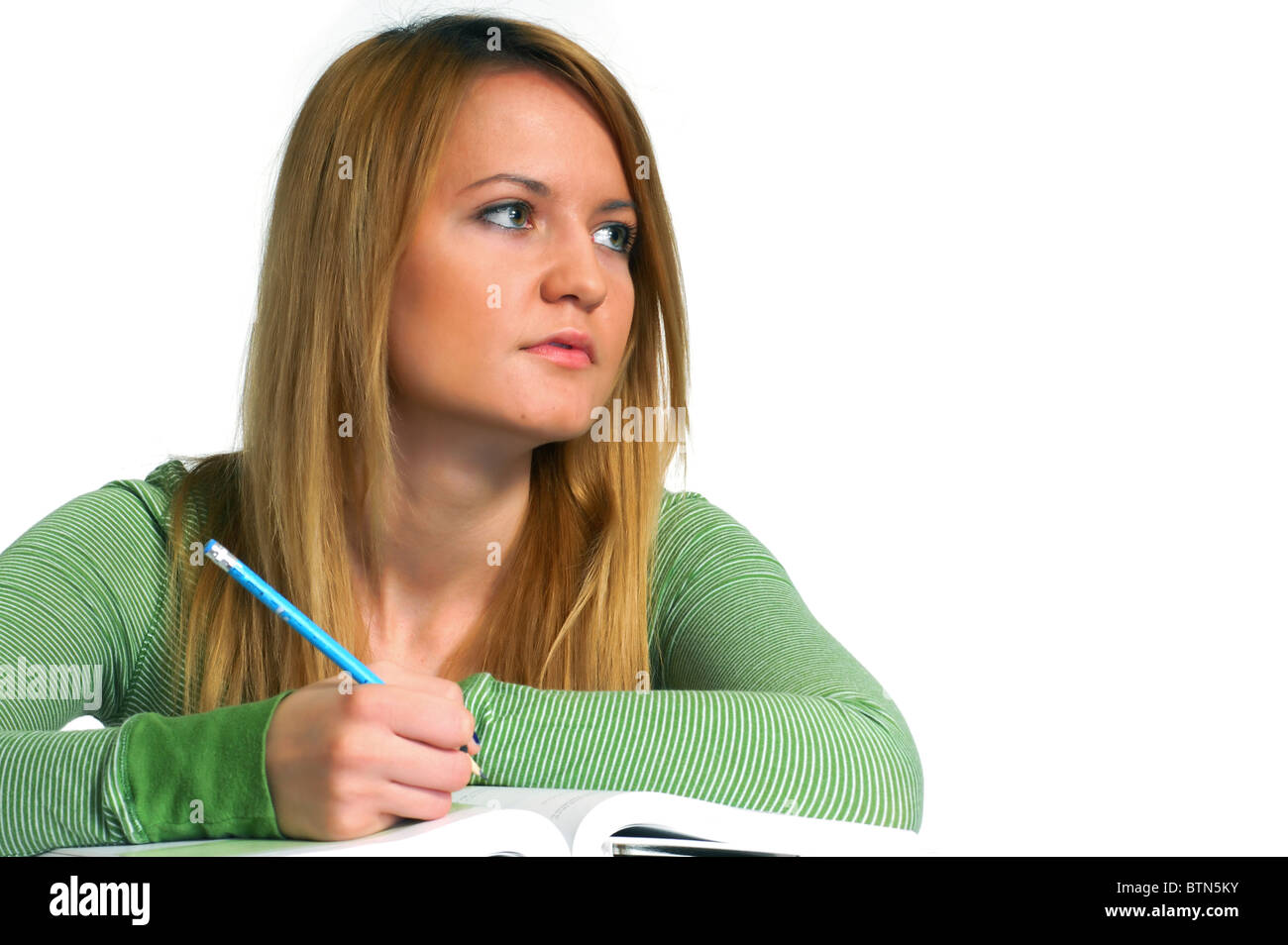 Portrait of a beautiful young female student, holding pencil Stock Photo