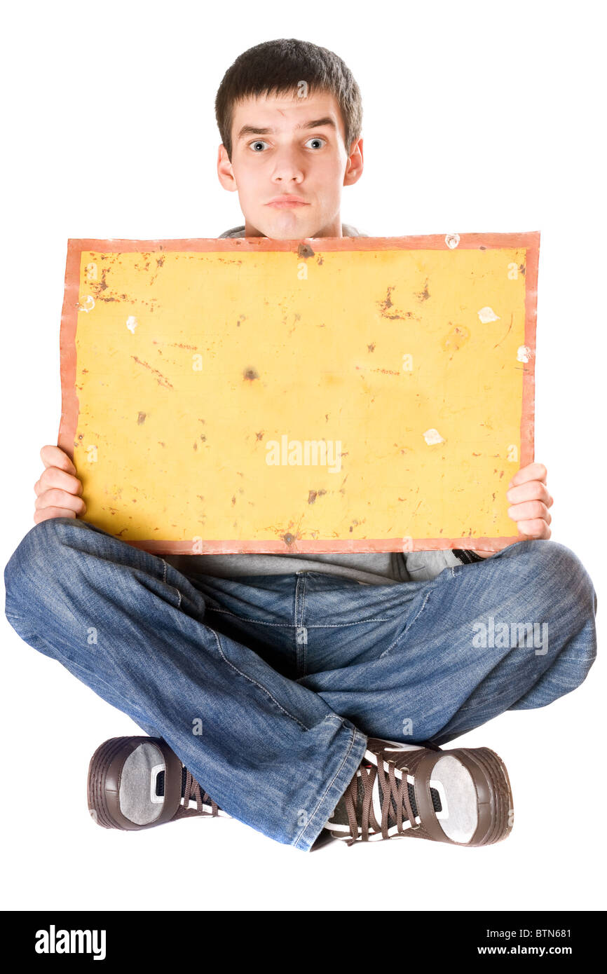 Surprised young man holding vintage yellow board Stock Photo