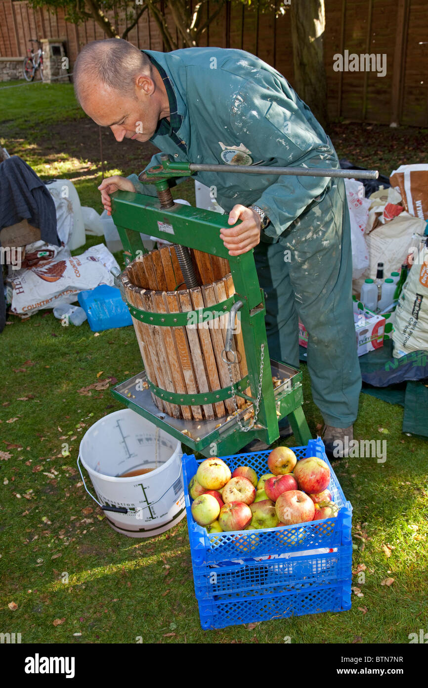 Transition Cleeve members making apple juice Tithe Barn Cleeve UK October 2010 Stock