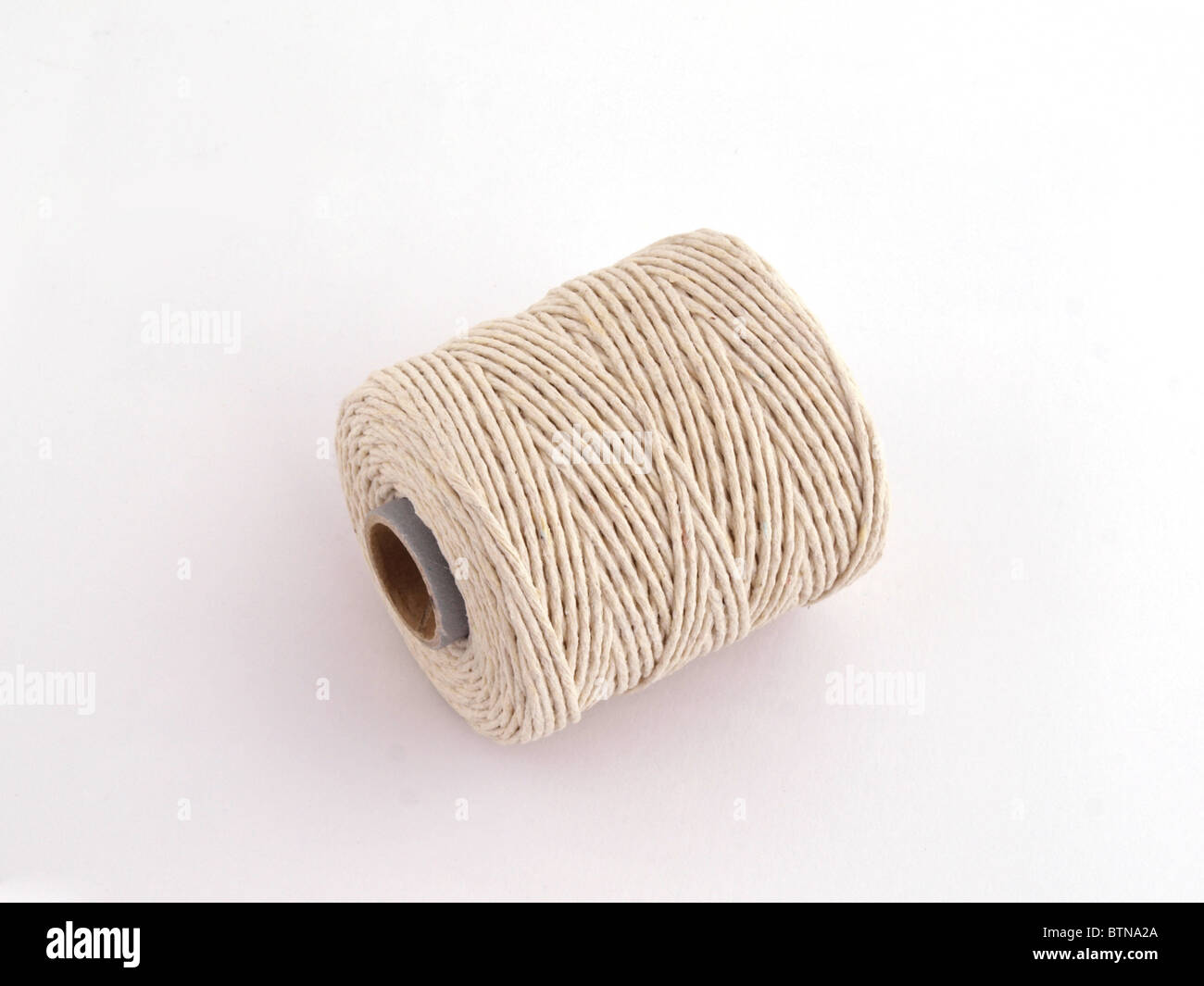 Ball of string or twine on a plain white background. Stock Photo