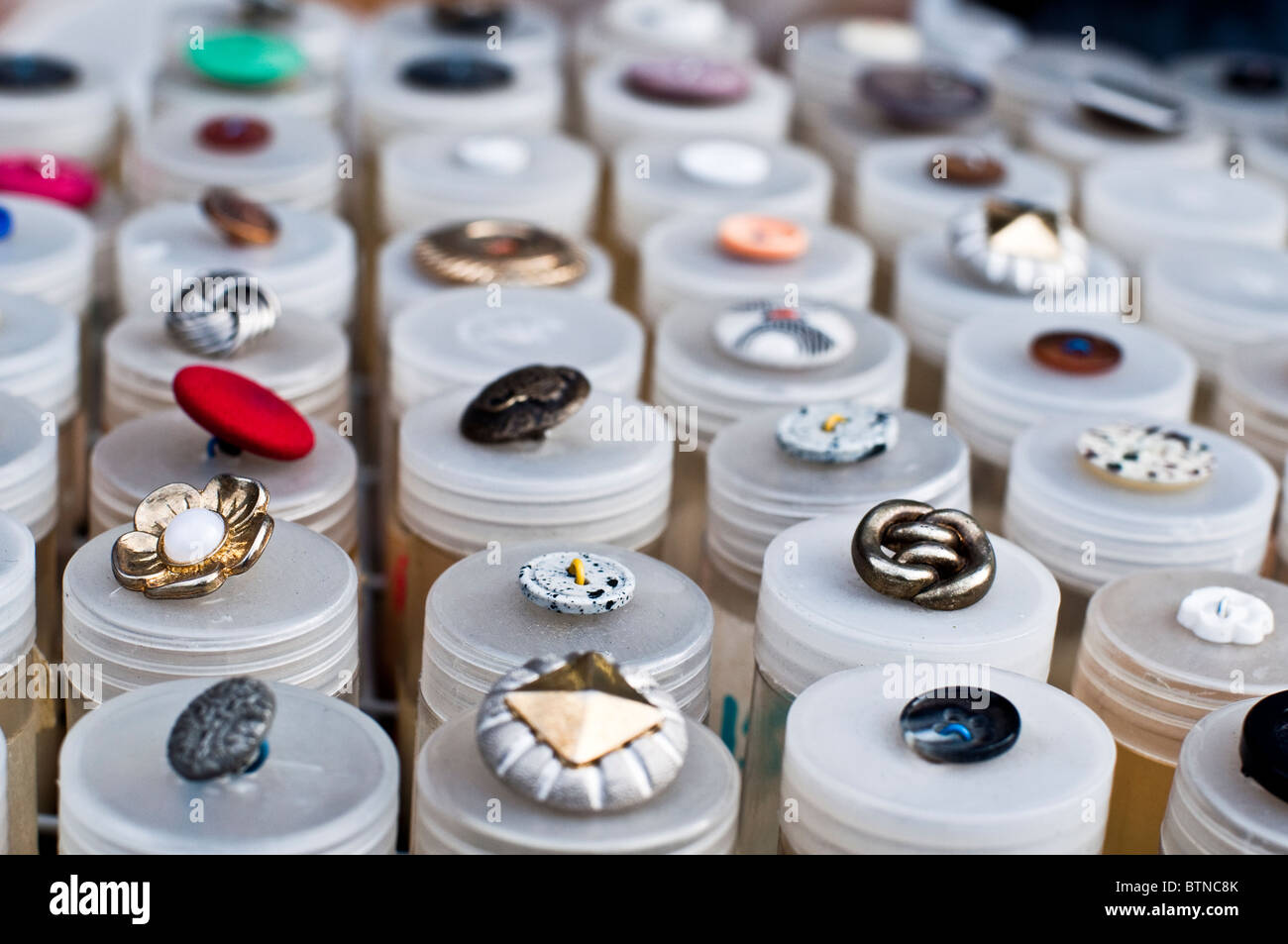 Buttons for sale in Ridley Road Market in Dalston, Hackney, a neighbourhood in North East London. Stock Photo