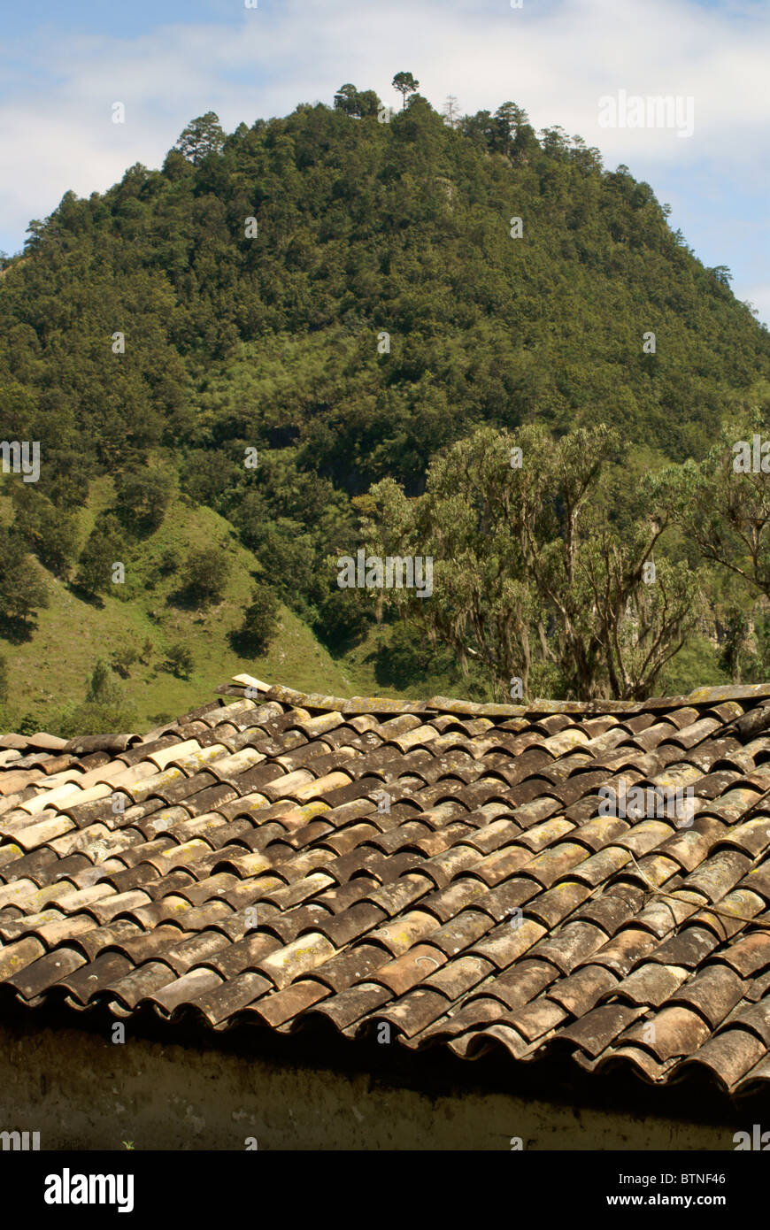 Red tiled roof and hill in the Lenca Indian village of La Campa, Lempira, Honduras Stock Photo