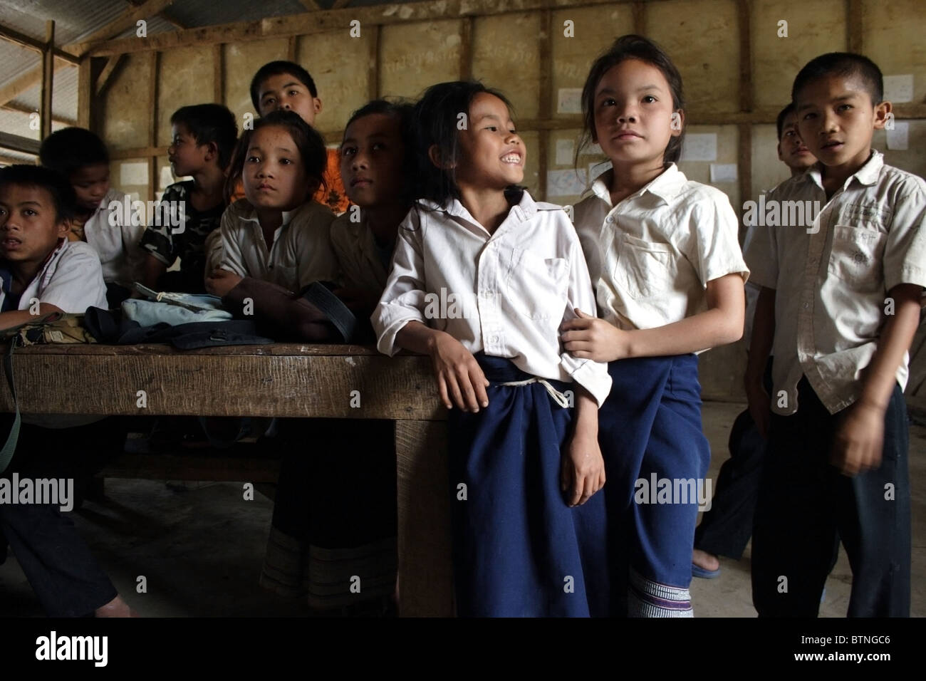 9 and 10 year old students are listening to a teacher at The Ban Buamlao Primary School in Ban Buamlao, Laos. Stock Photo