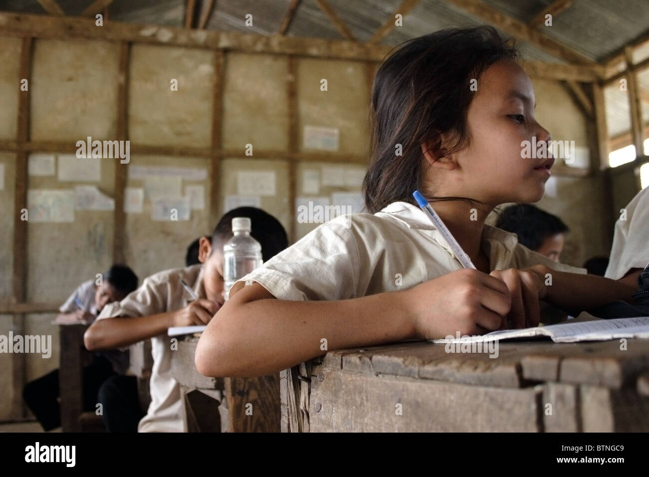 9 to 12 year old students are studying in a classroom at The Ban Buamlao Primary School in Ban Buamlao, Laos. Stock Photo