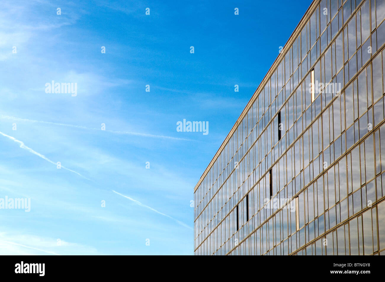 Modern building under blue sky with clouds Stock Photo