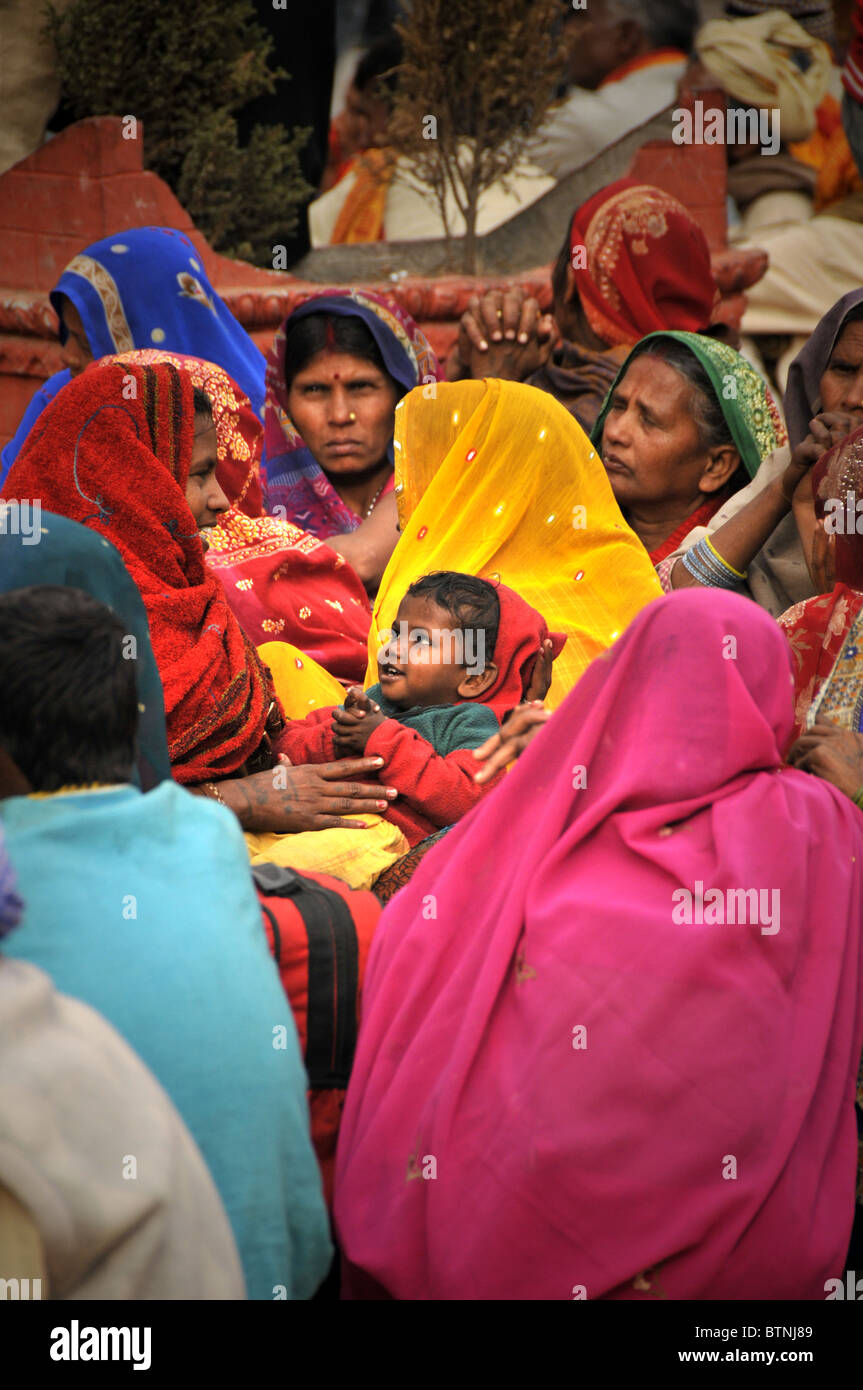 Women  make a break during a political demonstration in Kathmandu. They wear the traditional colorful dress. Stock Photo