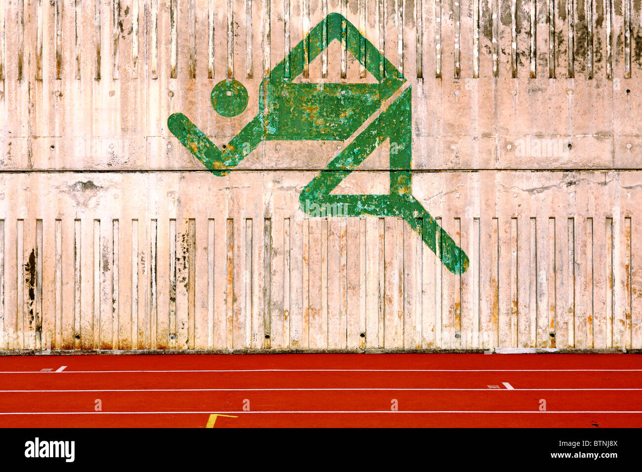 running track and a logo on the wall Stock Photo