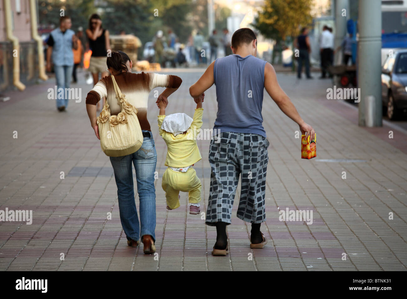 A young family taking a walk in the city, Brest, Belarus Stock Photo