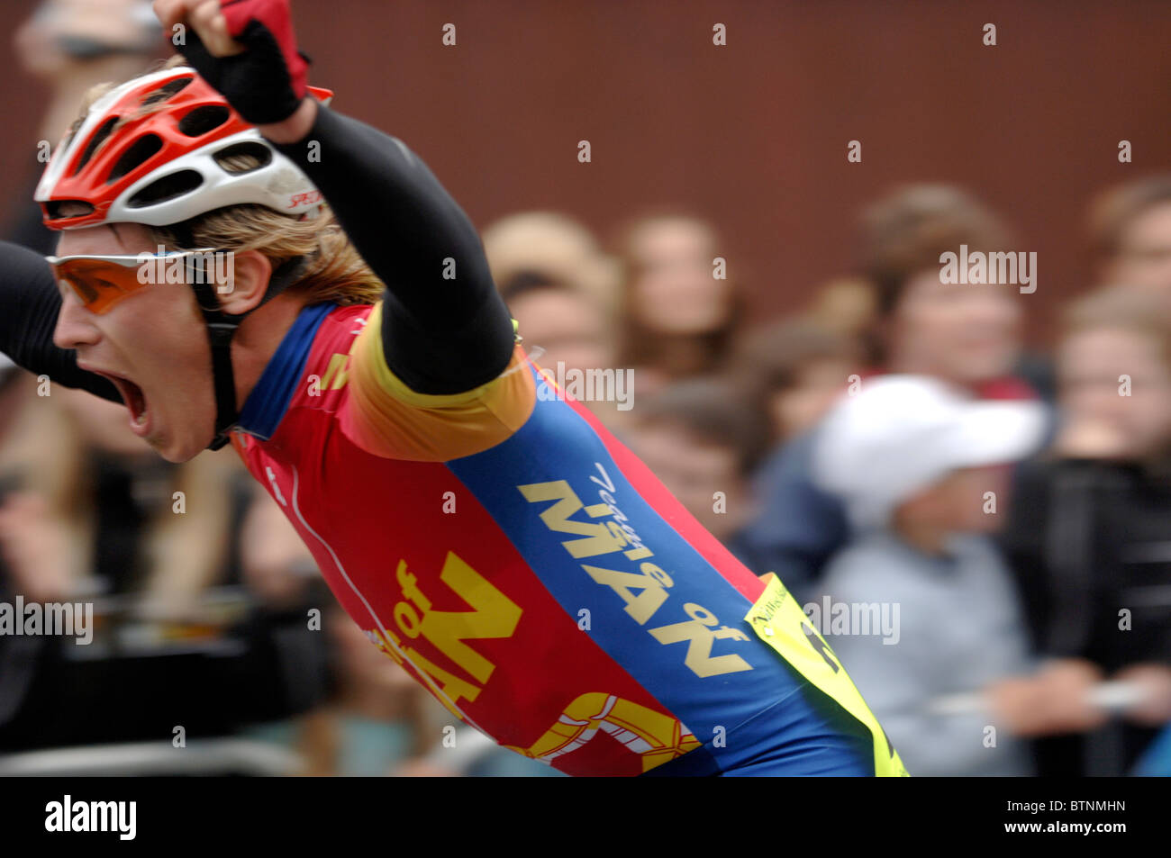 Triumphant cyclist Stock Photo