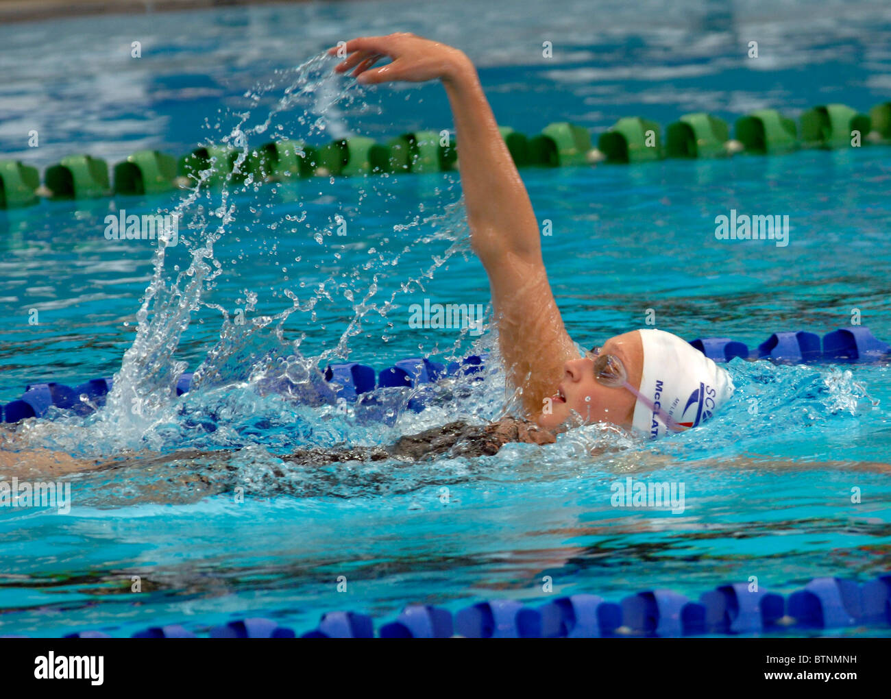 18-20 year old female swimming backstroke Stock Photo