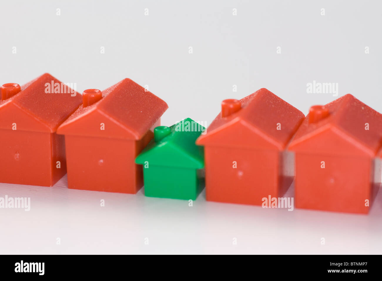 Monopoly houses in a row. Stock Photo