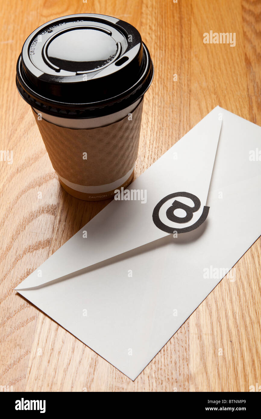 Coffee cup and Envelope with @ Symbol, concept of E-Mail Stock Photo ...