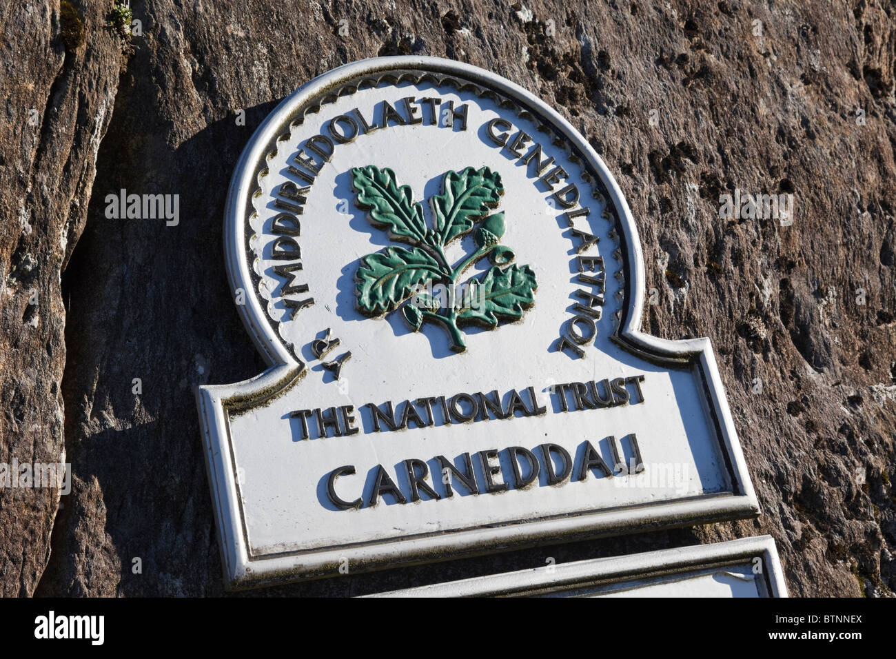 Sign on rocks below the Carneddau in Snowdonia National Park. Ogwen, Conwy, North Wales, UK, Britain Stock Photo