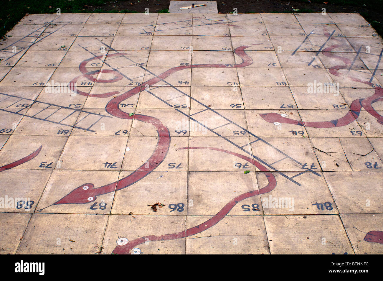 Outdoor snakes and ladders game Stock Photo