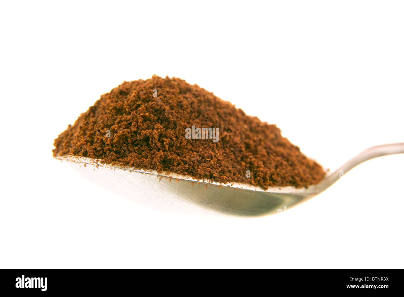 Mound of coffee on the spoon Stock Photo