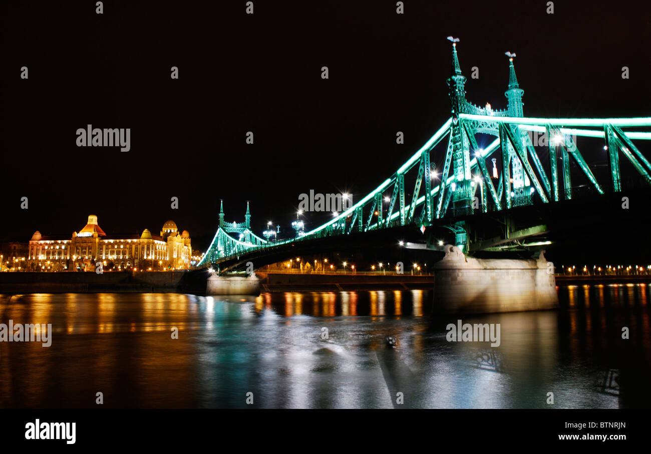 Budapest by night. Hotel Gellért spa and termal bath, the Danube river and Liberty Bridge (Szabadság híd, aka Freedom bridge). Stock Photo