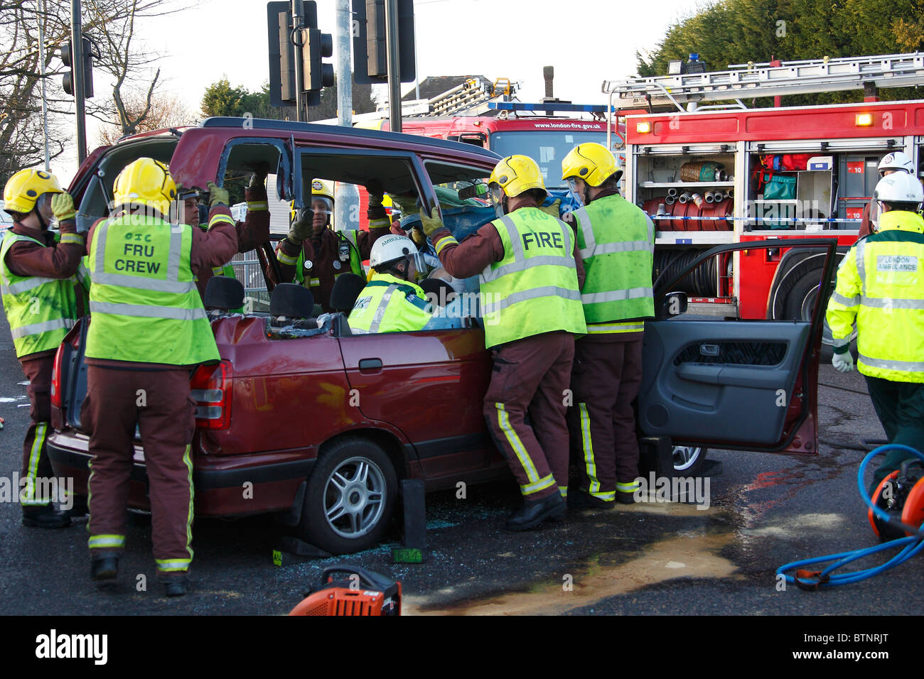 London Fireifhters extricating a road crash victim Stock Photo