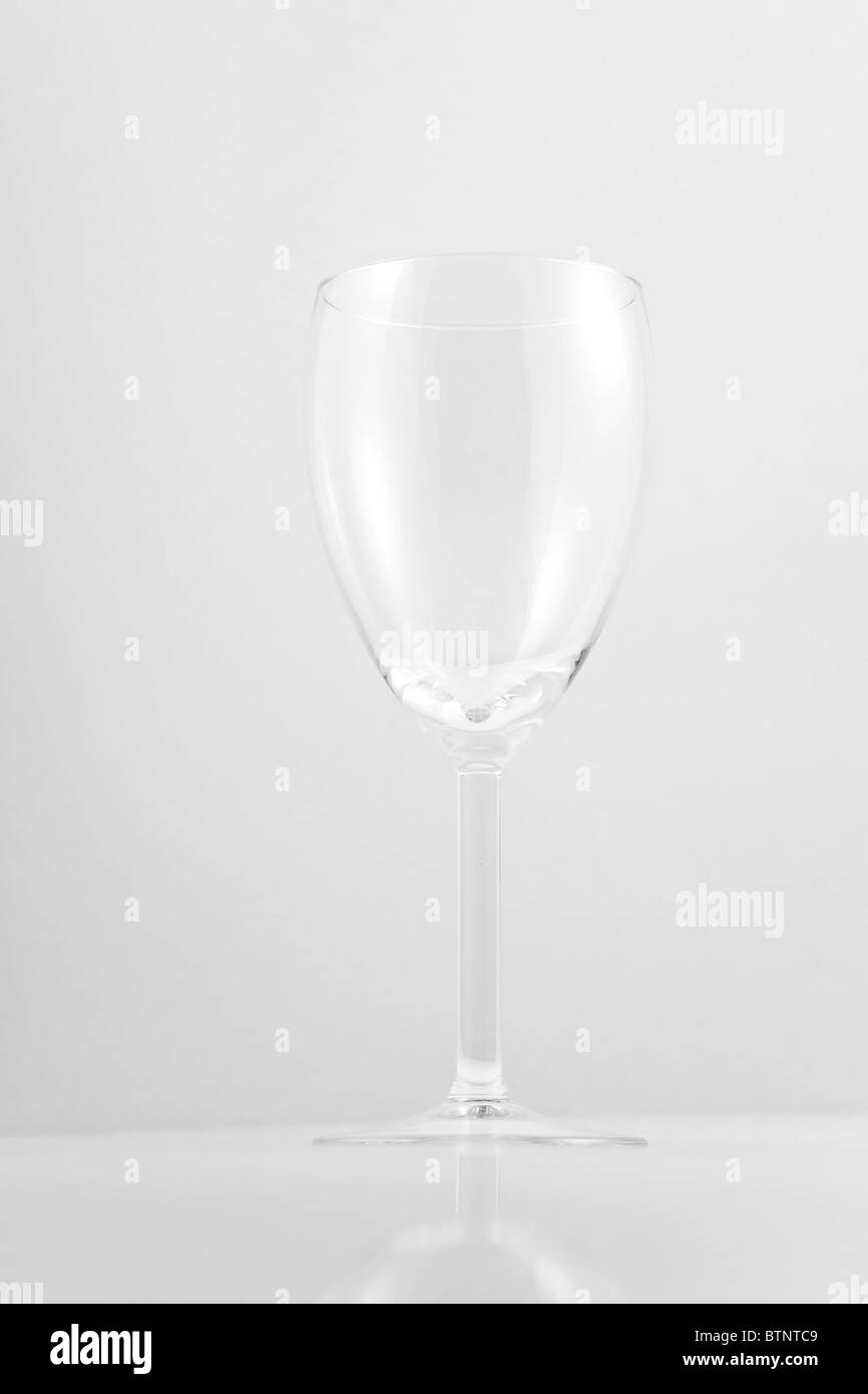 Empty white wine glass on white background Stock Photo