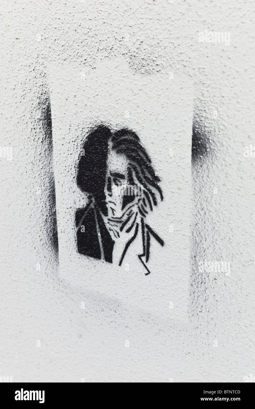 Stencil / Graffiti showing a portrait of Beethoven on a bright wall in Schwabing, Munich Stock Photo