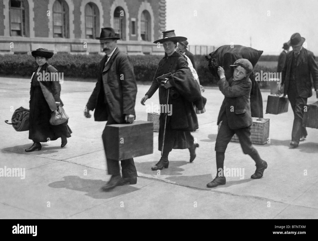 Vintage photo circa 1907 of immigrants arriving at Ellis Island in New York. Stock Photo