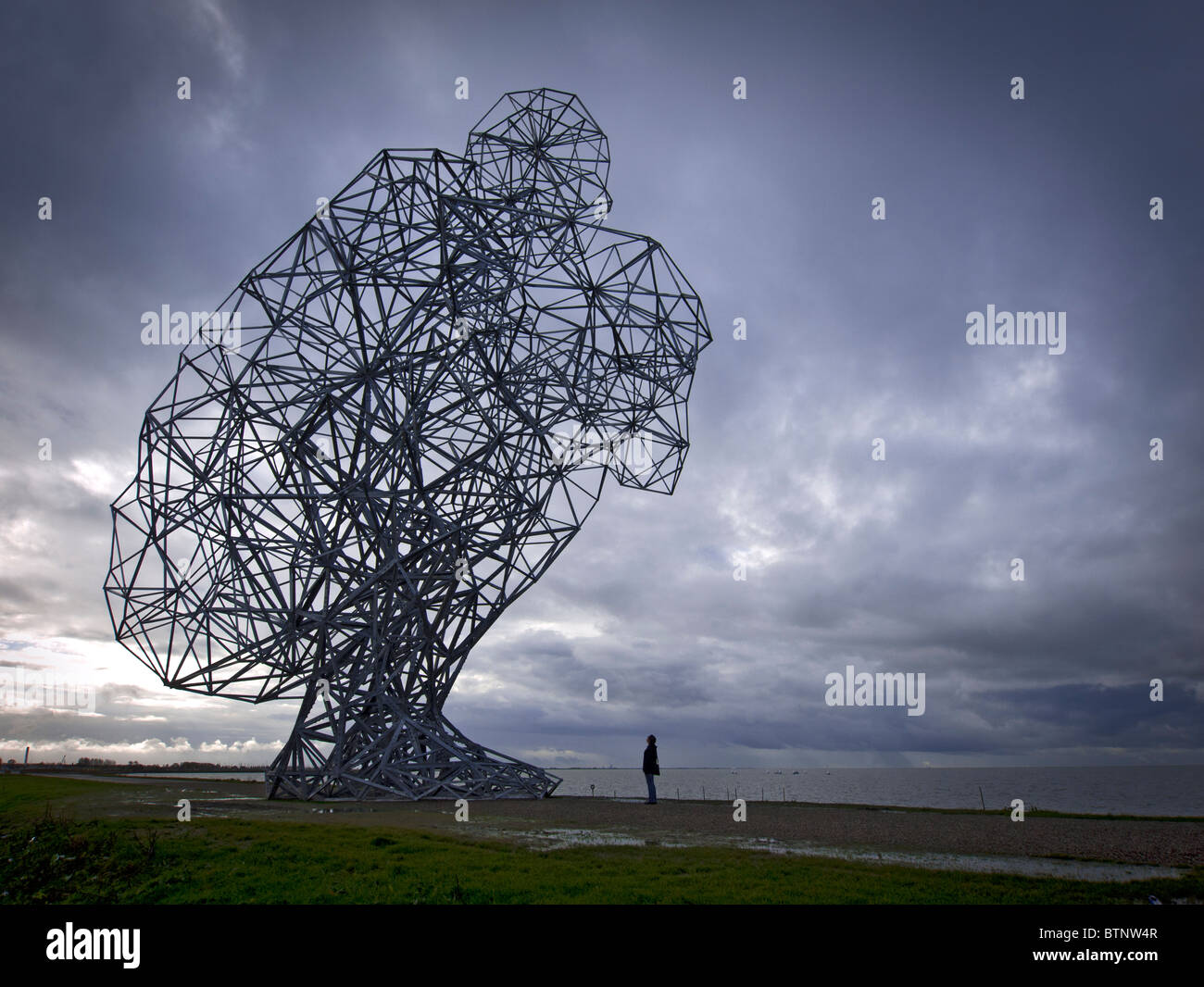 Antony Gormley's new sculpture called Exposure on sea dyke at Lelystad in The Netherlands Stock Photo