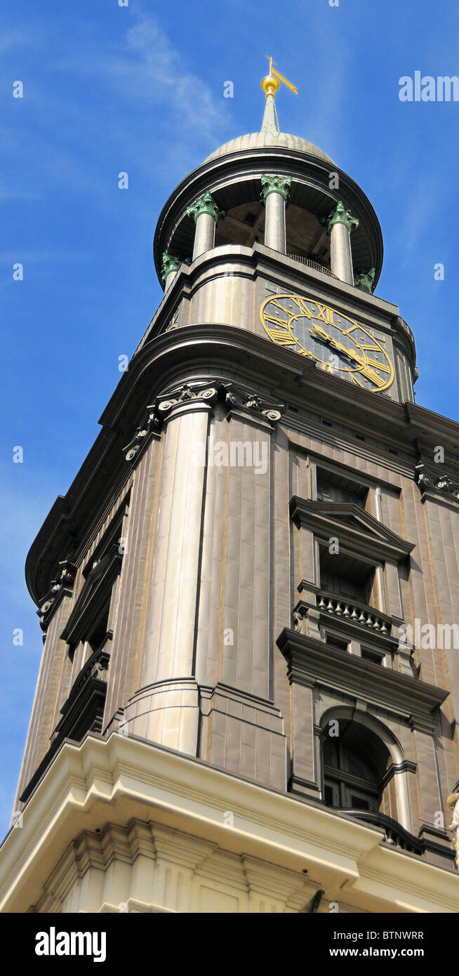 The 132 m-high baroque spire, covered with copper, is a prominent feature of the St. Michaelis Church in Hamburg, Germany. Stock Photo
